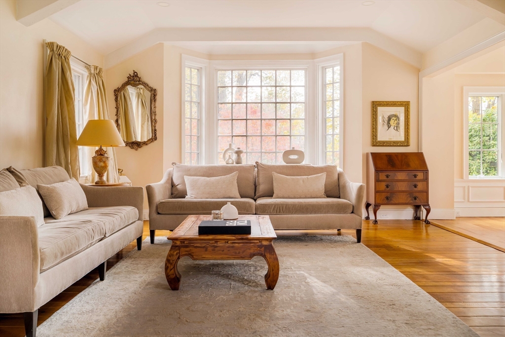30 Prospect Street Winchester, MA 01890 - Photo 22 of 42 a living room with furniture a fireplace and a window