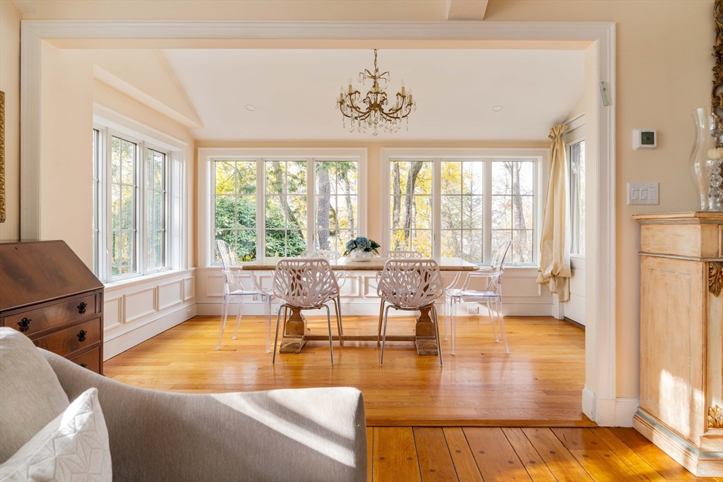 30 Prospect Street Winchester, MA 01890 - Photo 24 of 42 a living room with furniture and a table with wooden floor