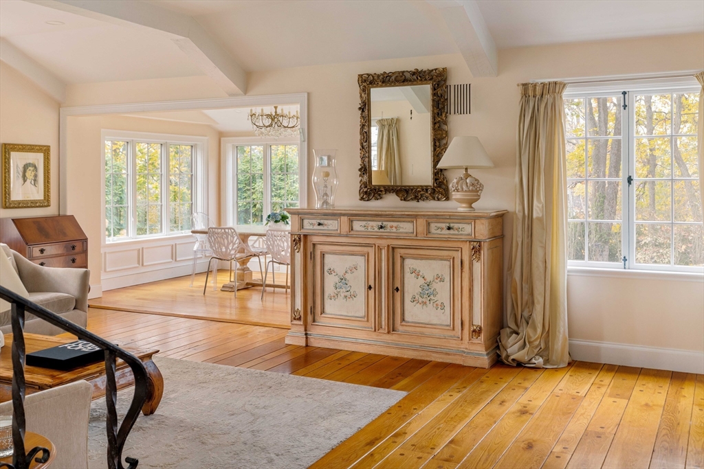 30 Prospect Street Winchester, MA 01890 - Photo 28 of 42 a living room with furniture a flat screen tv and floor to ceiling windows