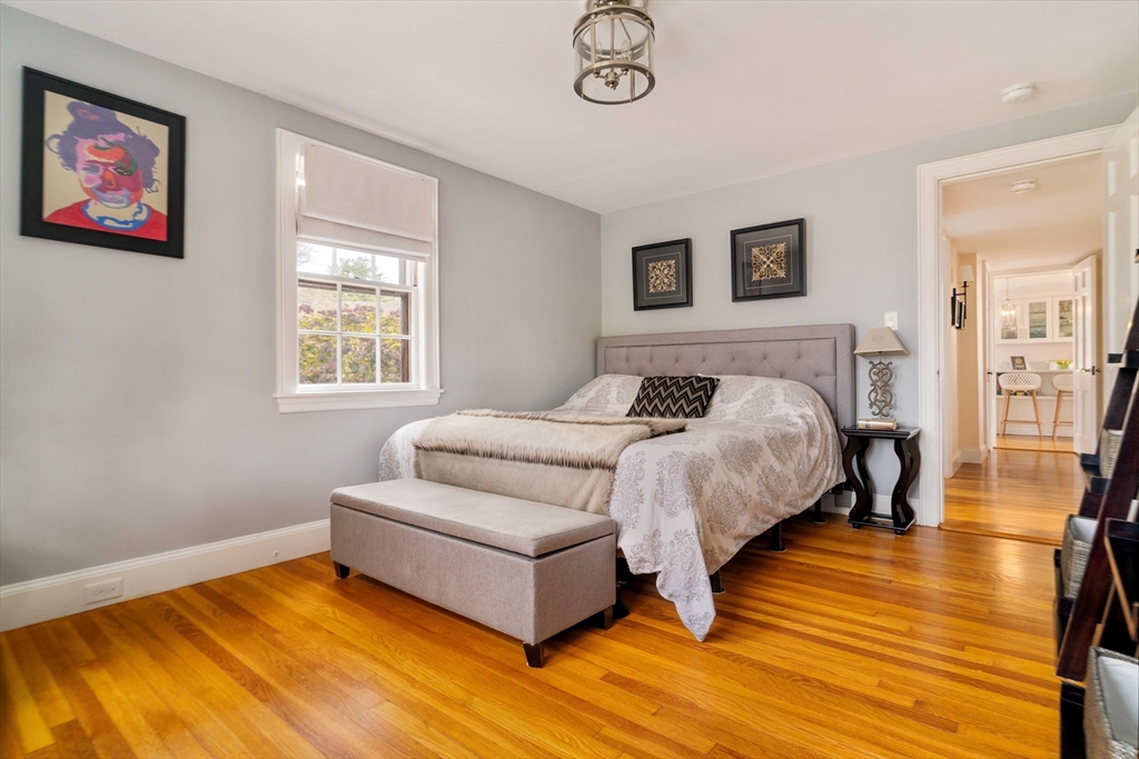 30 Prospect Street Winchester, MA 01890 - Photo 30 of 42 a bedroom with a bed and a table