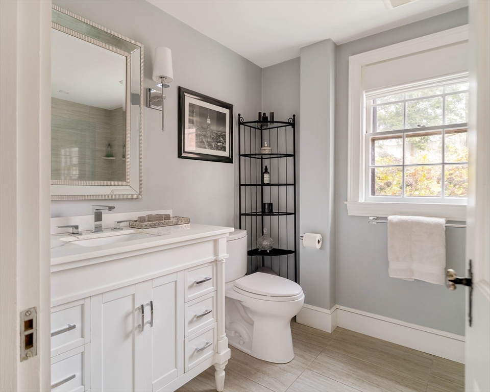 30 Prospect Street Winchester, MA 01890 - Photo 31 of 42 a bathroom with a sink toilet vanity and shower