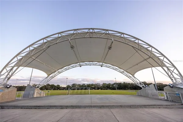 a view of a big building with swimming pool