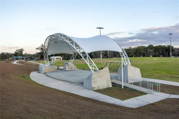 a view of swimming pool with a patio