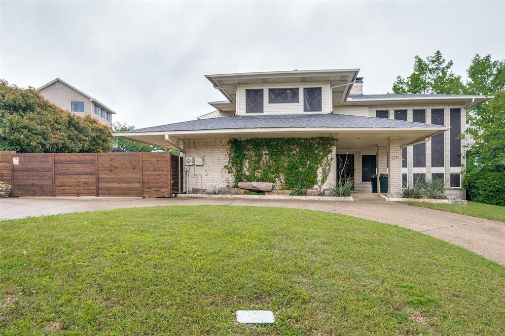 1211 Stonewall Trail Heath, TX 75032 - Photo 1 of 1 a view of a house with a yard and sitting area