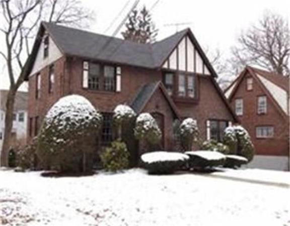44 Fenno Road Newton, MA 02459 - Photo 1 of 2 a view of a house with a yard covered in snow