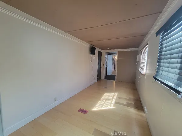 a view of a bathroom with toilet and shower