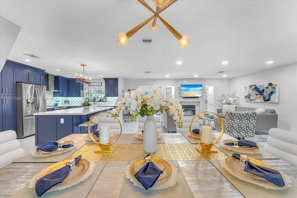 4103 Polk Street Hollywood, FL 33021 - Photo 16 of 55 a living room with lots of furniture and kitchen view