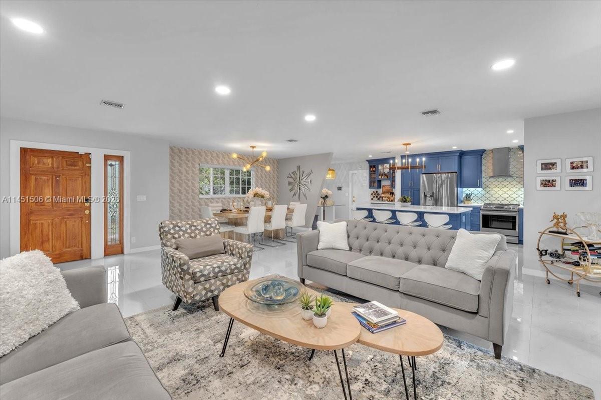 4103 Polk Street Hollywood, FL 33021 - Photo 18 of 55 a living room with furniture kitchen and a table