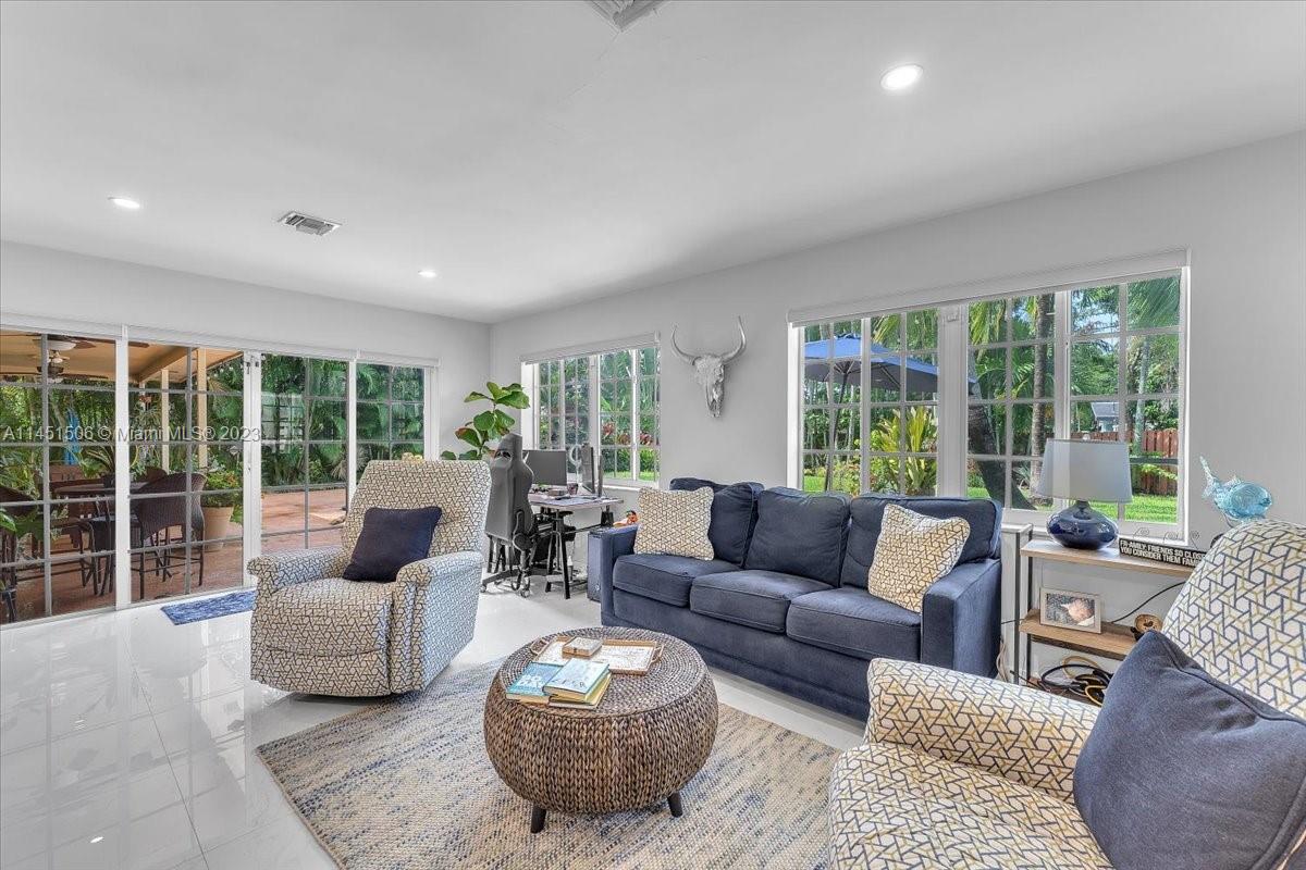 4103 Polk Street Hollywood, FL 33021 - Photo 22 of 55 a living room with furniture and a large window