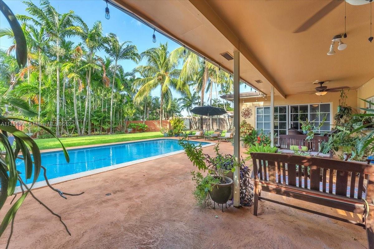 4103 Polk Street Hollywood, FL 33021 - Photo 37 of 55 a view of a swimming pool with a porch and furniture