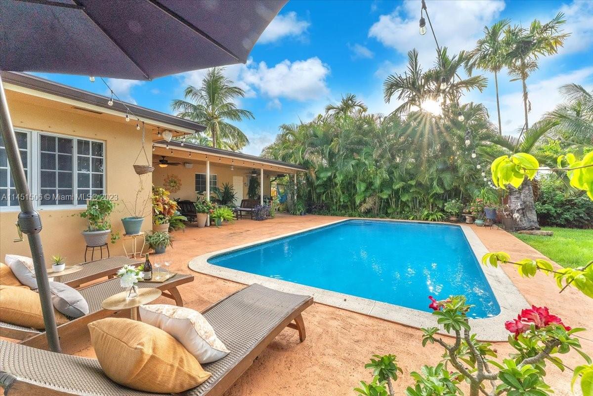 4103 Polk Street Hollywood, FL 33021 - Photo 39 of 55 a view of swimming pool with outdoor seating and plants