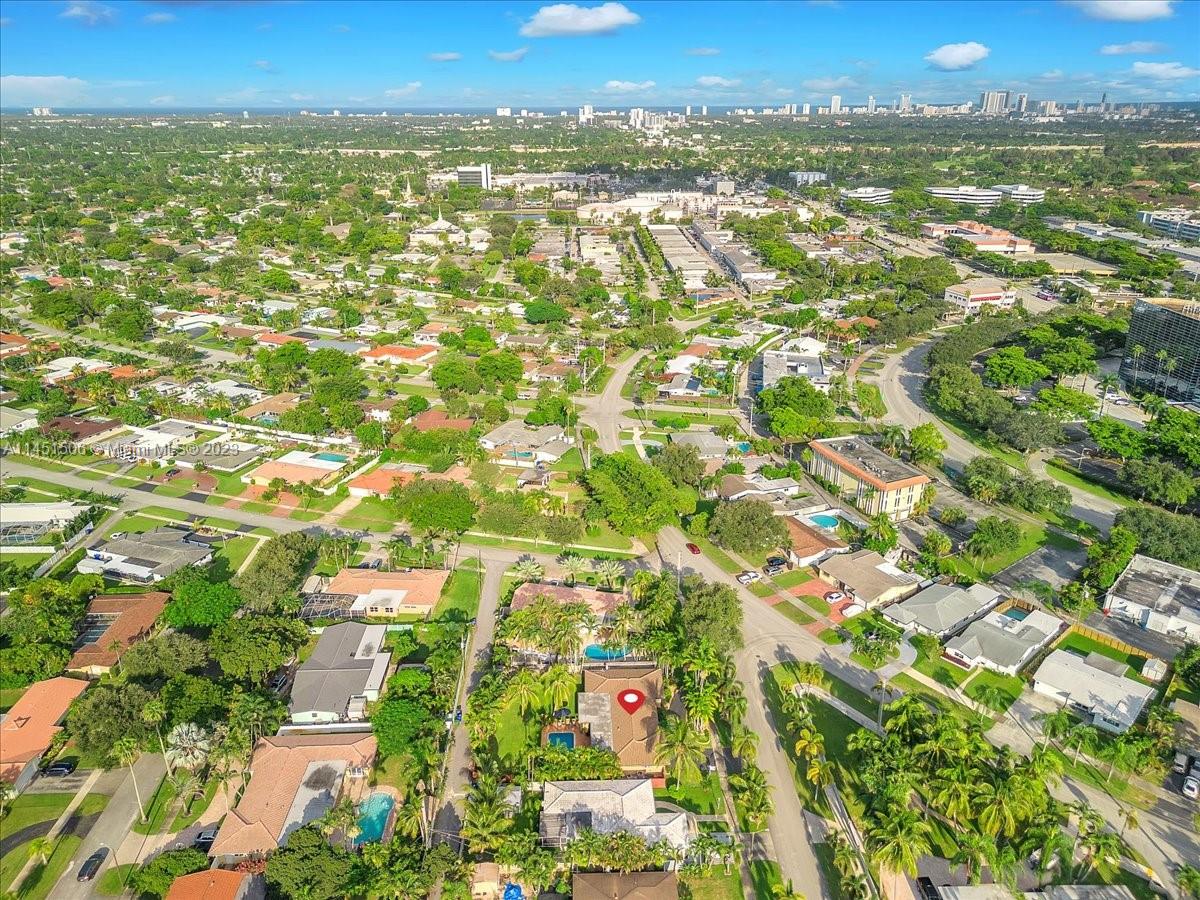 4103 Polk Street Hollywood, FL 33021 - Photo 50 of 55 an aerial view of residential houses with outdoor space and trees