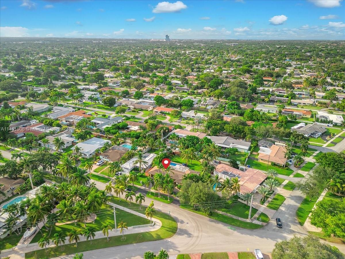 4103 Polk Street Hollywood, FL 33021 - Photo 51 of 55 an aerial view of residential houses with outdoor space and trees