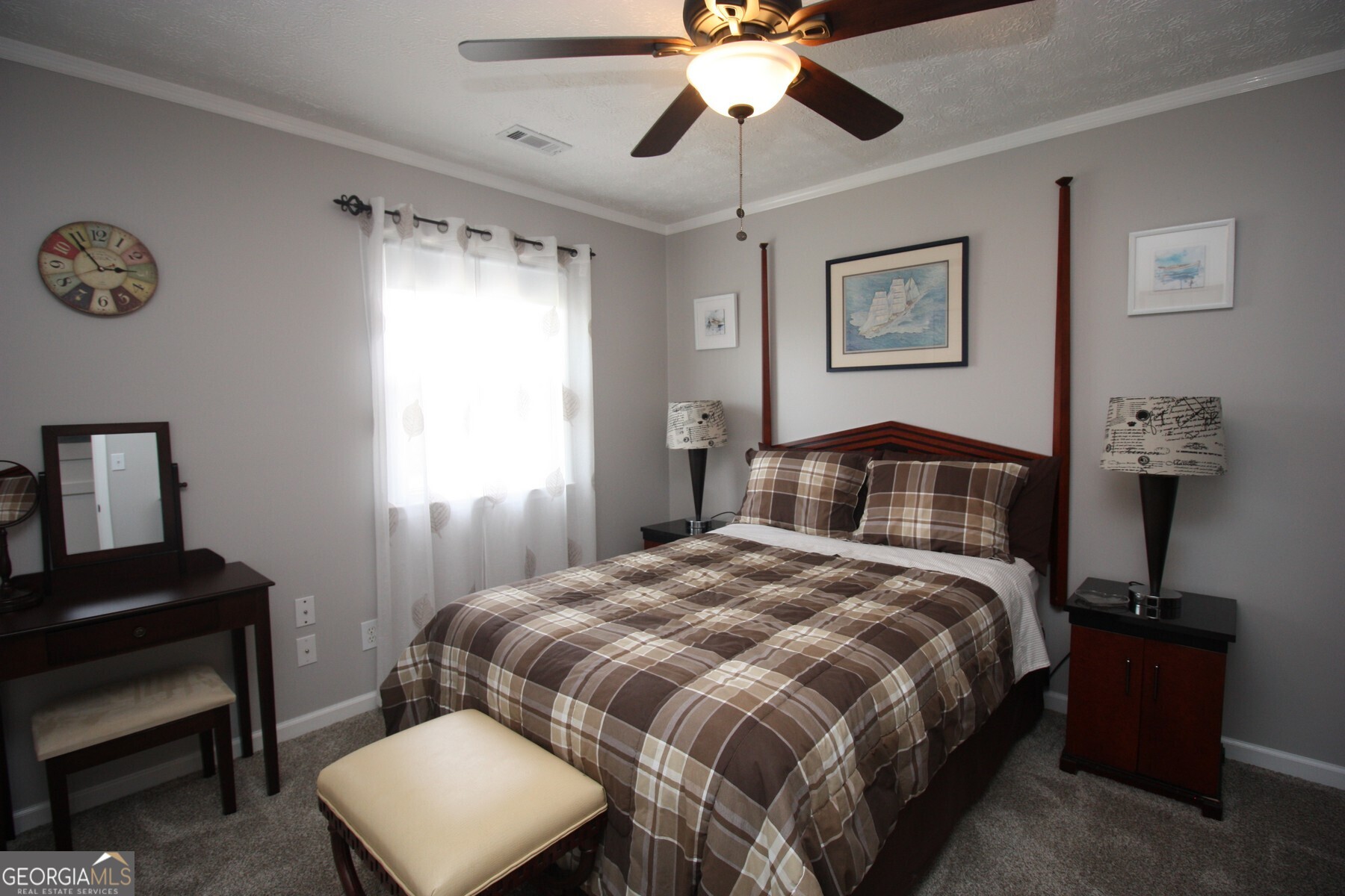 231 Murphy Road LaGrange, GA 30240 - Photo 17 of 24 a bedroom with a bed and a chandelier