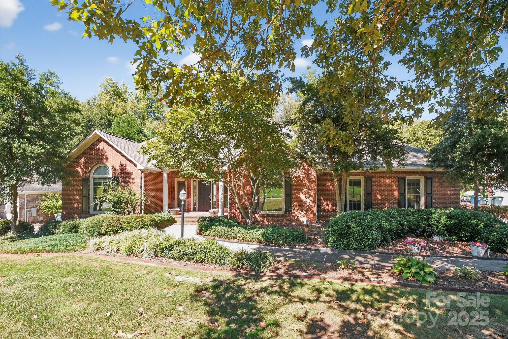 208 Stone Ridge Drive Salisbury, NC 28146 - Photo 1 of 35 a front view of a house with a yard and trees