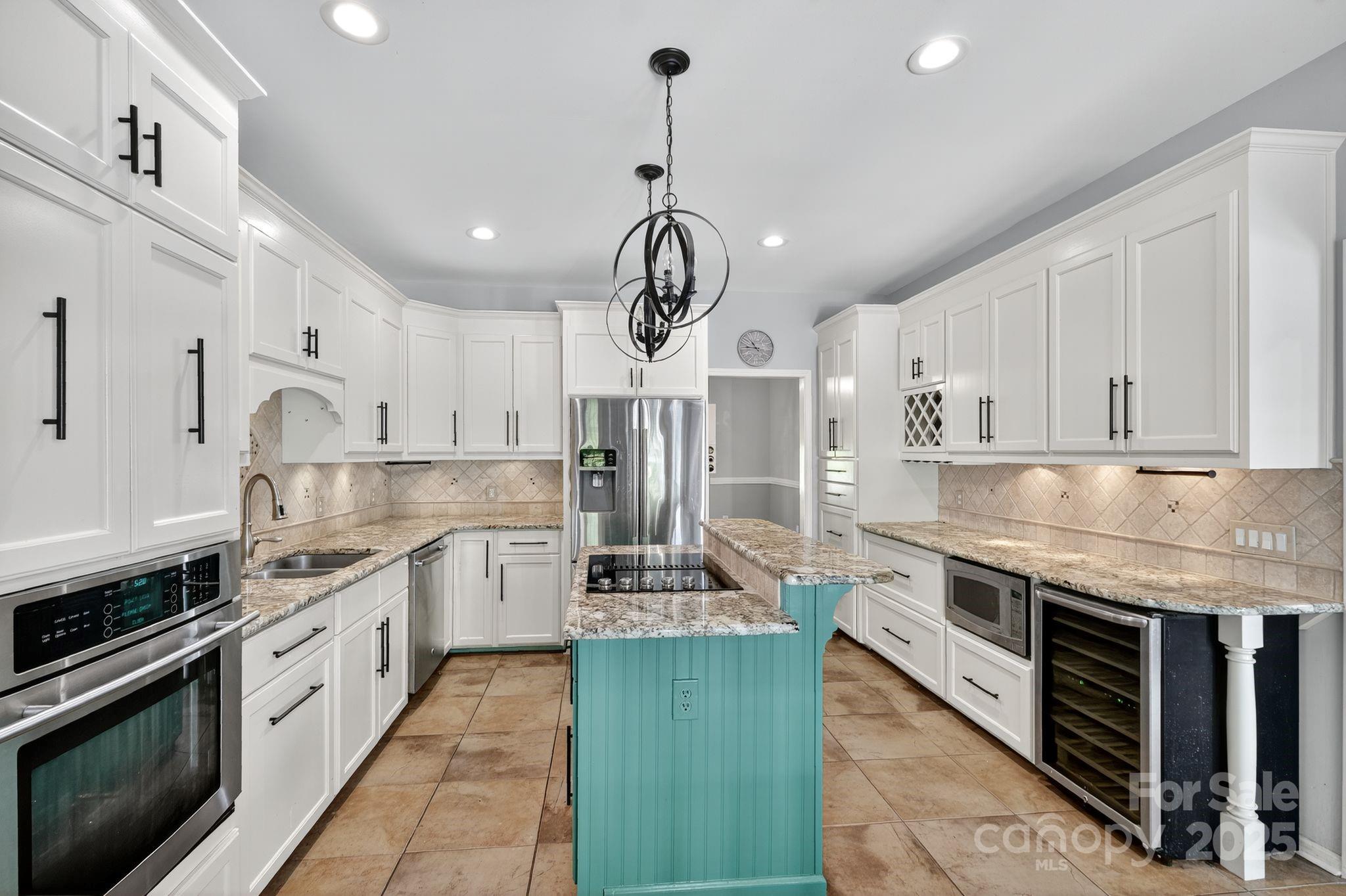 208 Stone Ridge Drive Salisbury, NC 28146 - Photo 13 of 35 a large kitchen with stainless steel appliances granite countertop a stove a sink dishwasher and a refrigerator