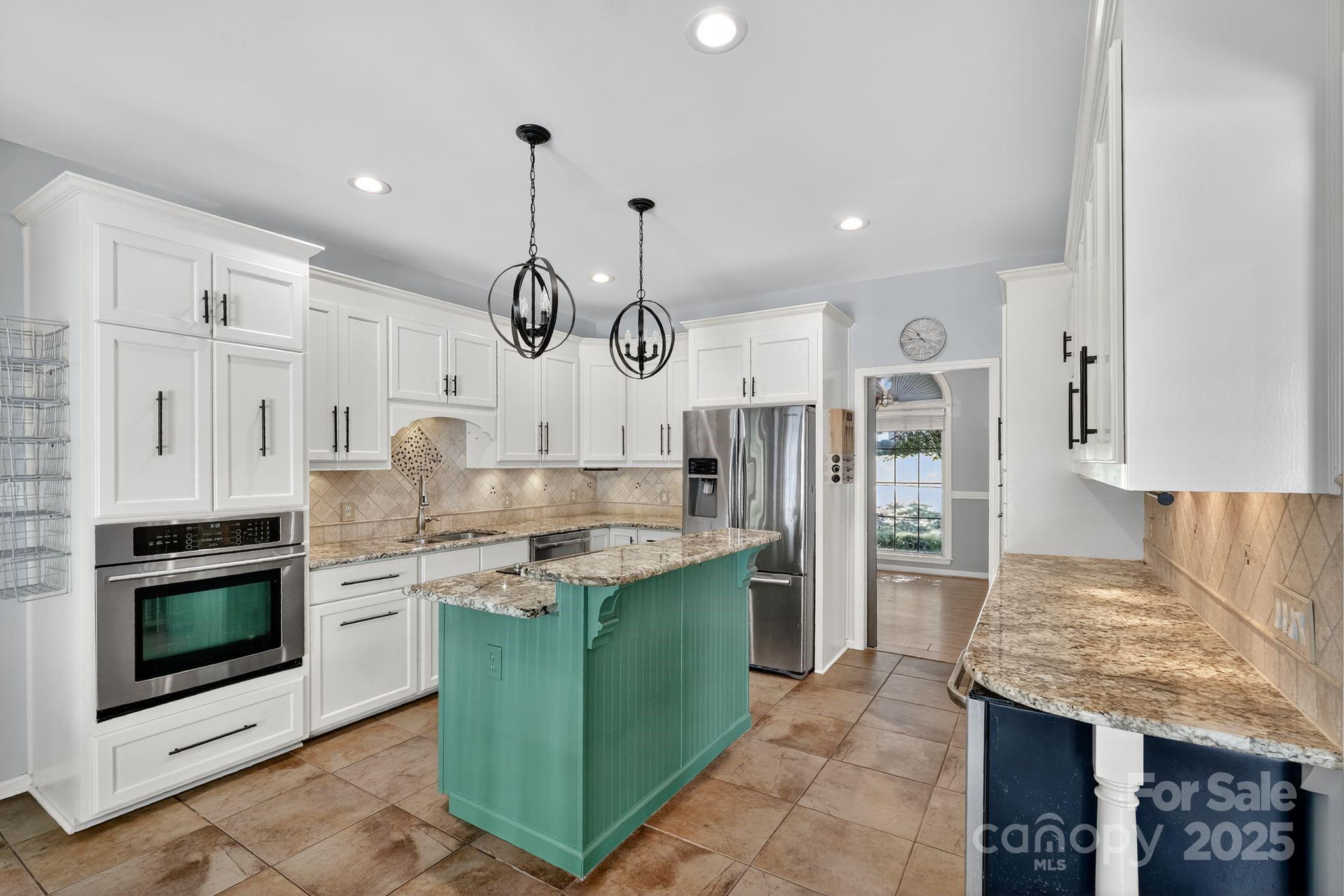 208 Stone Ridge Drive Salisbury, NC 28146 - Photo 14 of 35 a kitchen with cabinets and stainless steel appliances
