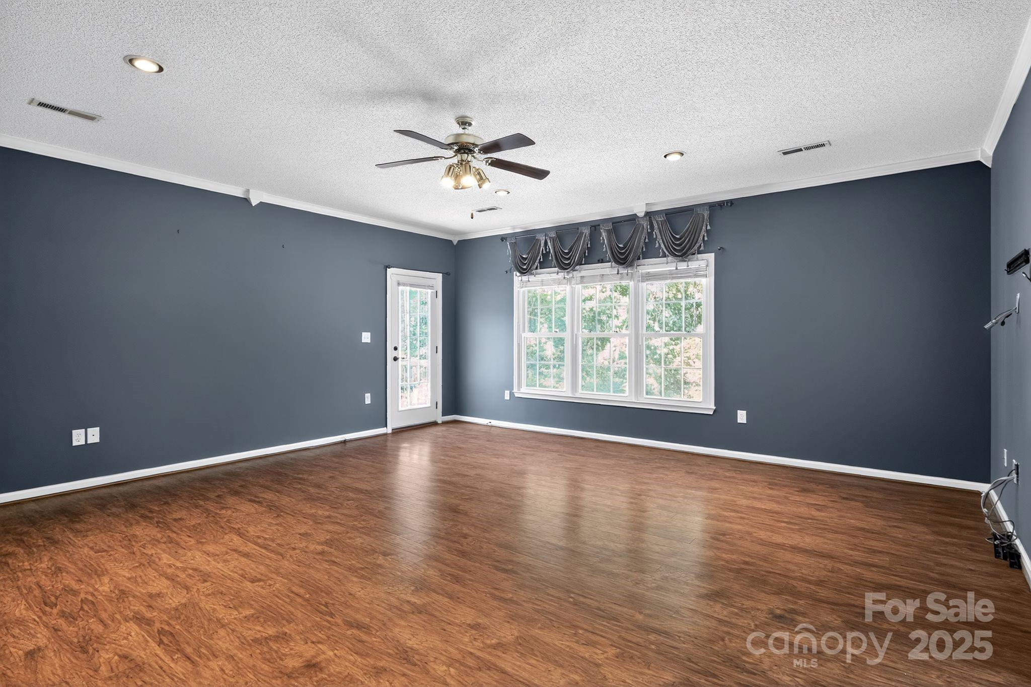 208 Stone Ridge Drive Salisbury, NC 28146 - Photo 19 of 35 wooden floor in an empty room with a window