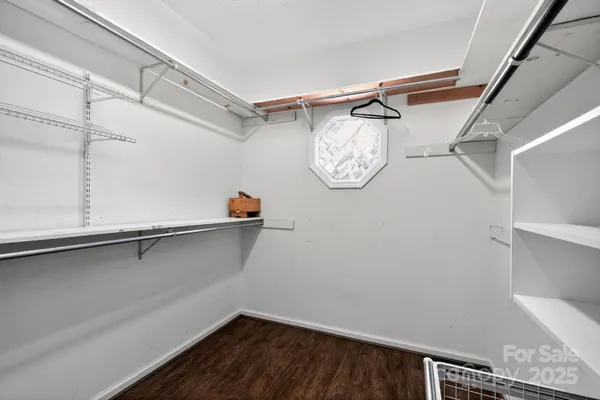 a view of a store room with racks on the wall