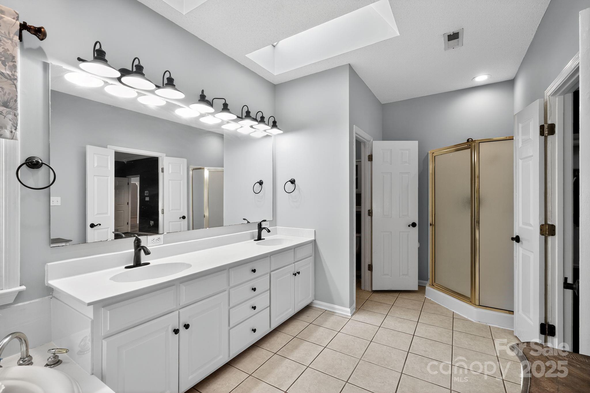 208 Stone Ridge Drive Salisbury, NC 28146 - Photo 22 of 35 a bathroom with a double vanity sink mirror and