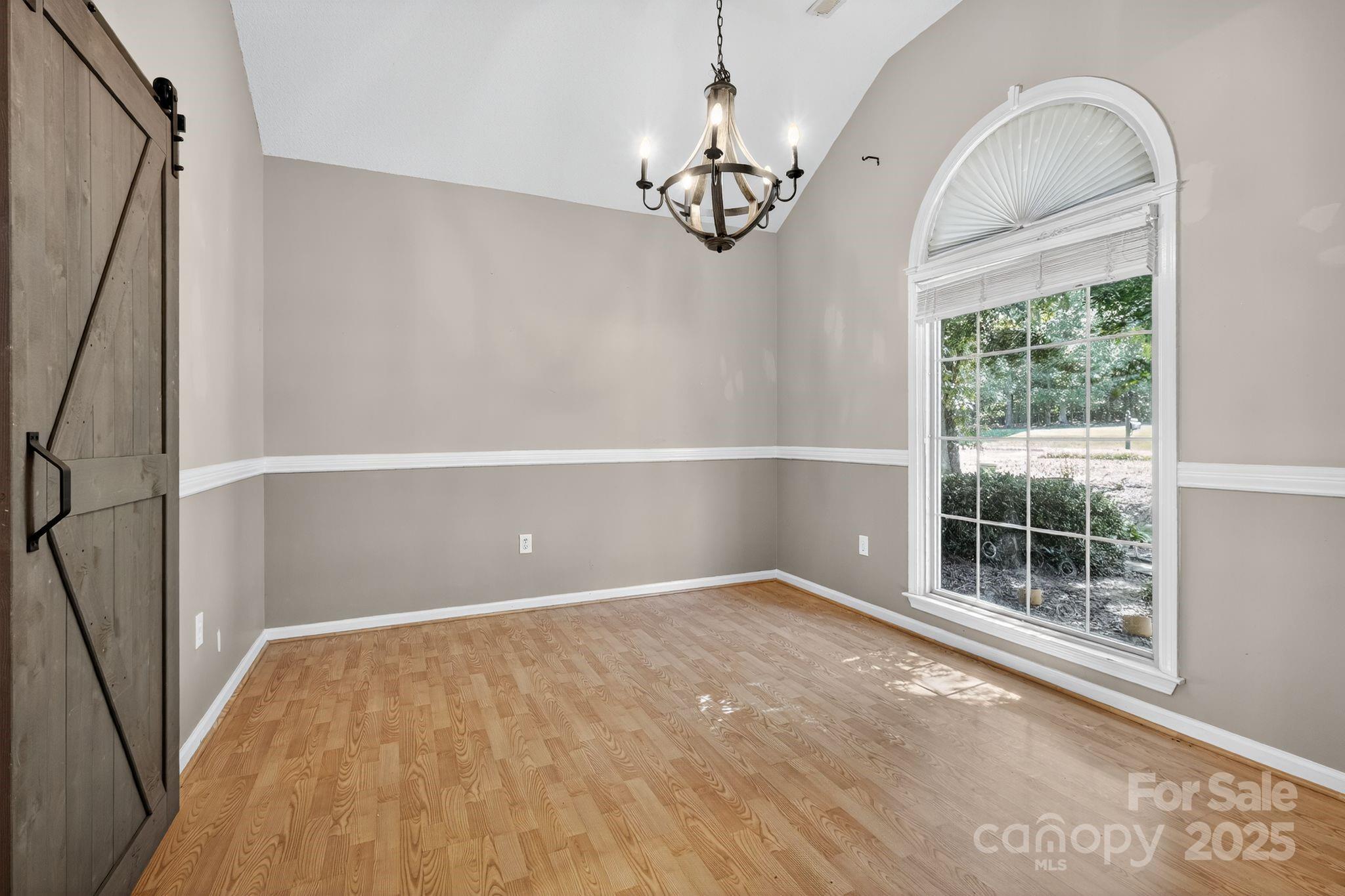 208 Stone Ridge Drive Salisbury, NC 28146 - Photo 23 of 35 wooden floor in an empty room with a window
