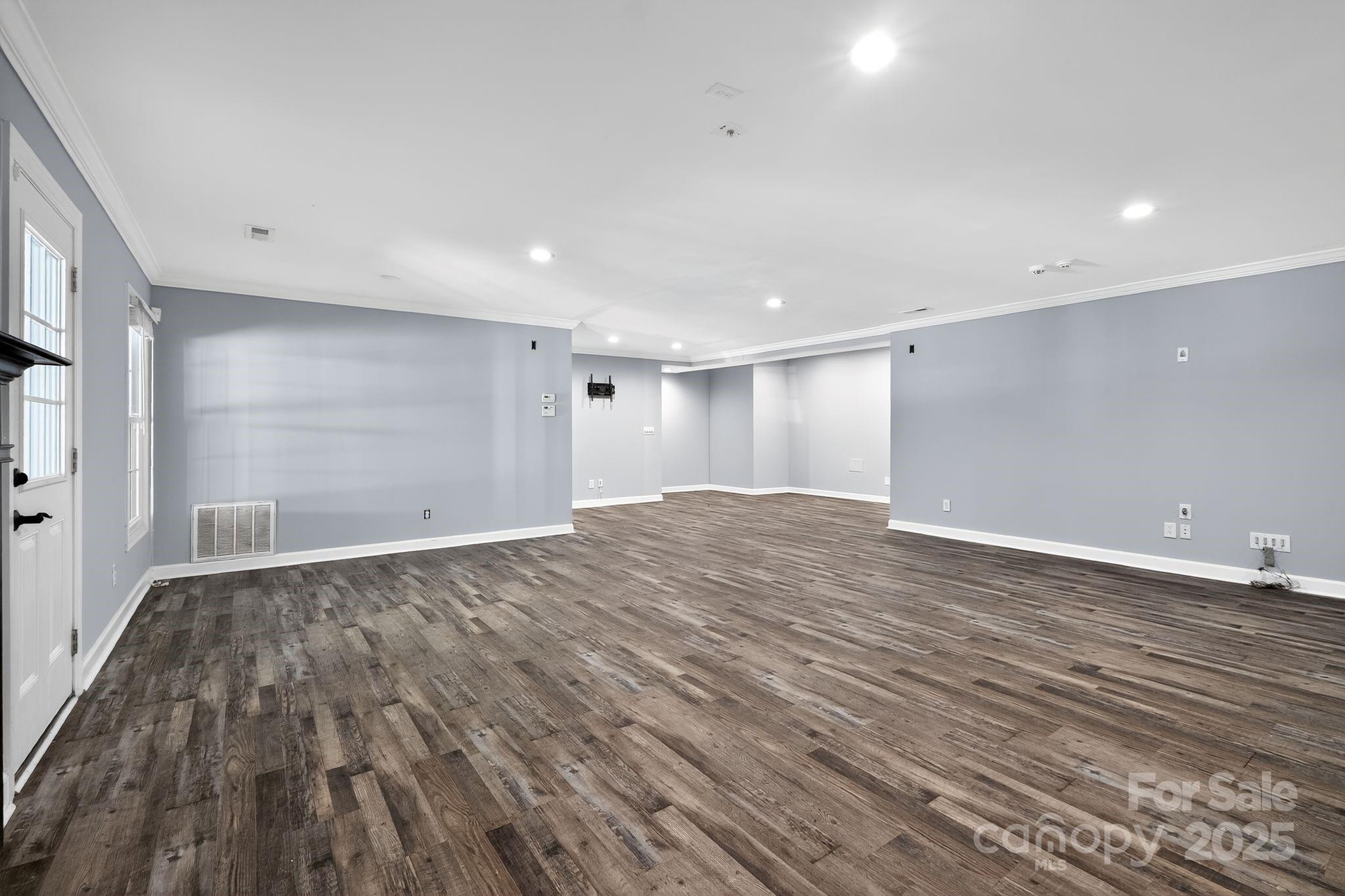 208 Stone Ridge Drive Salisbury, NC 28146 - Photo 26 of 35 a view of empty room with wooden floor