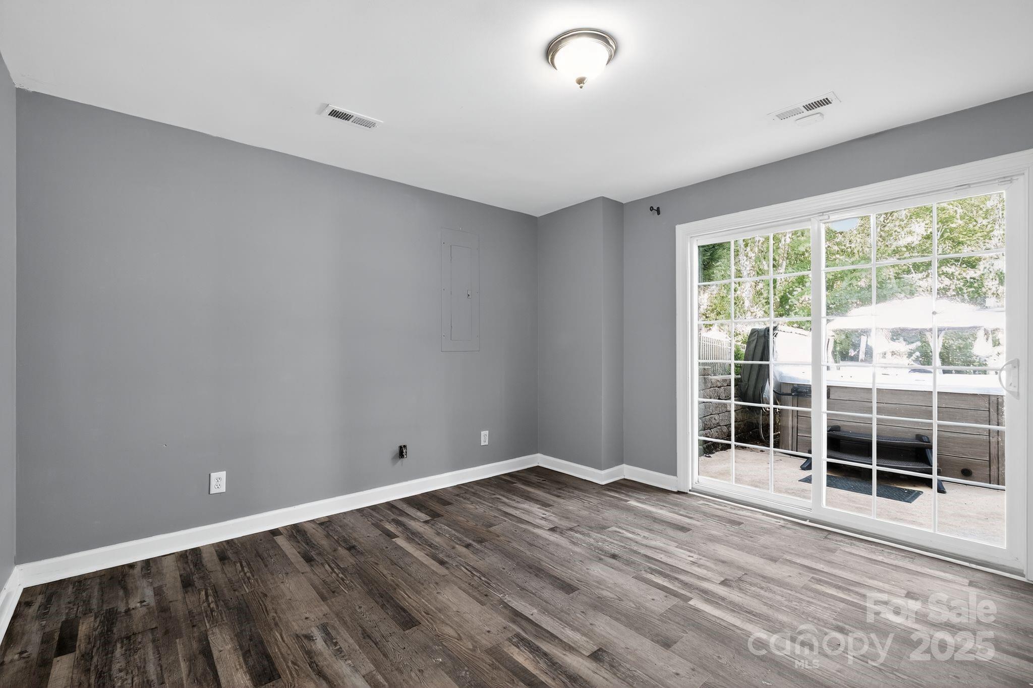 208 Stone Ridge Drive Salisbury, NC 28146 - Photo 27 of 35 a view of empty room with wooden floor and windows