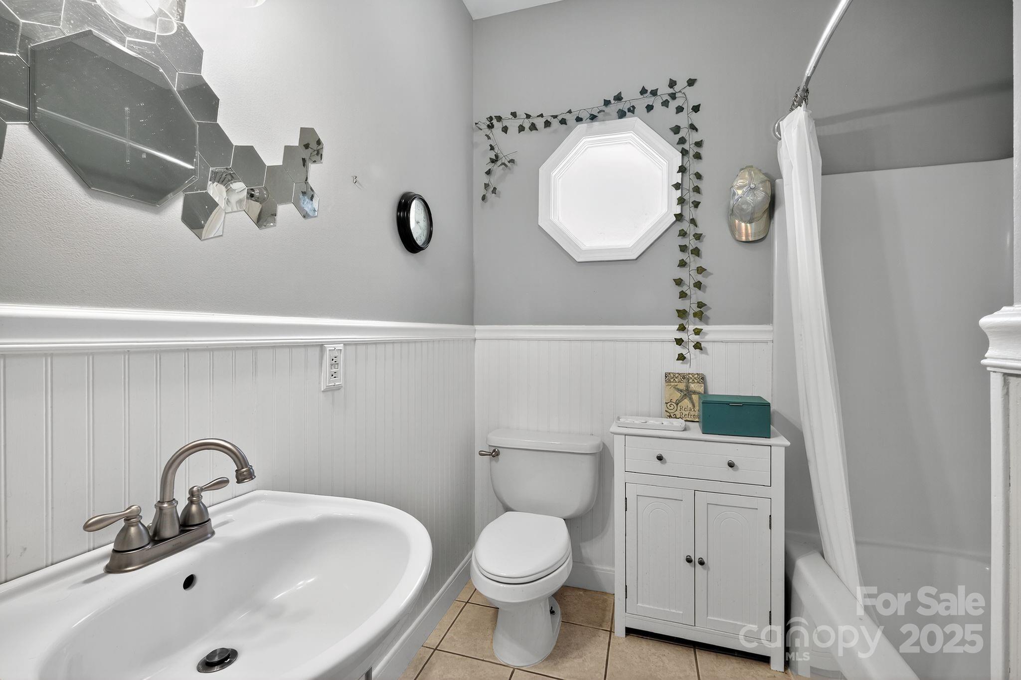 208 Stone Ridge Drive Salisbury, NC 28146 - Photo 29 of 35 a bathroom with a toilet sink and mirror