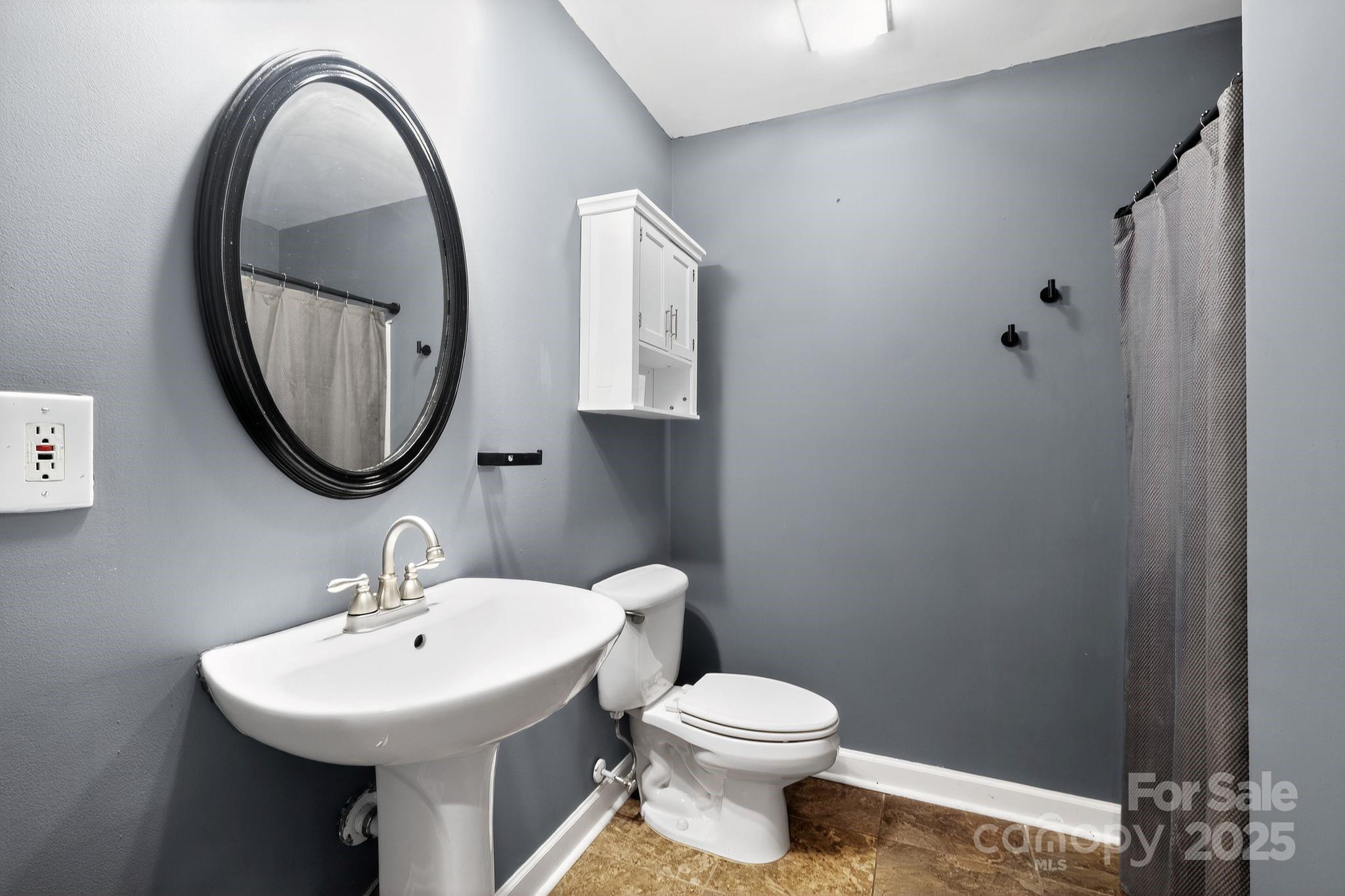 208 Stone Ridge Drive Salisbury, NC 28146 - Photo 30 of 35 a bathroom with a sink a mirror and a toilet