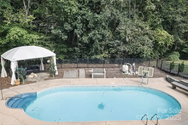 a view of a swimming pool with a patio