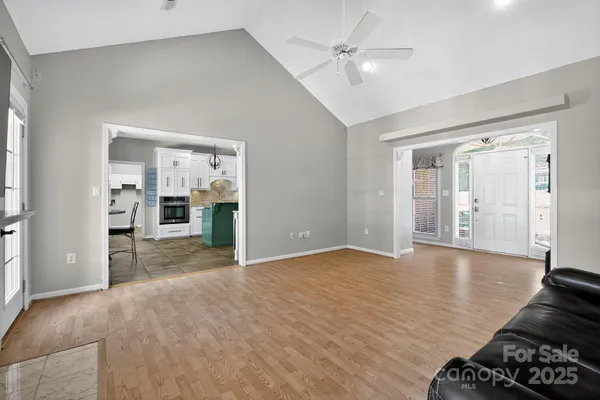 a view of livingroom with hardwood floor and a ceiling fan