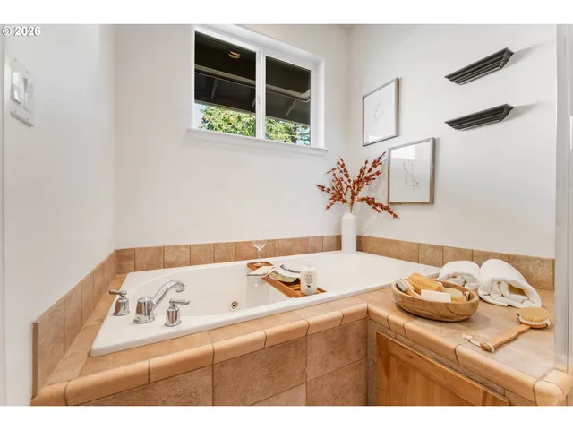 a bathroom with a sink and a window