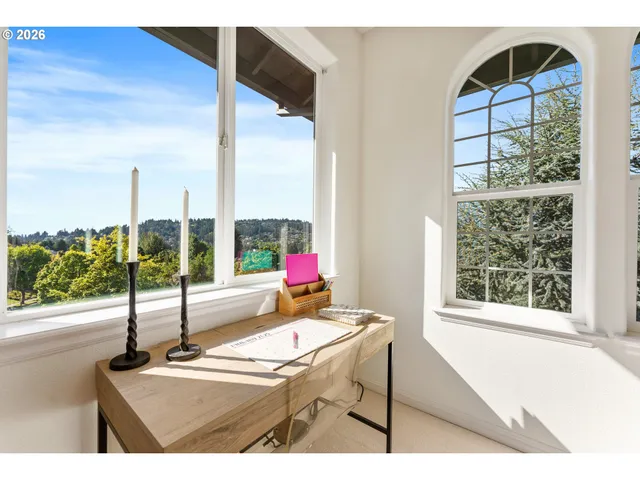 a dining room with a large window and table