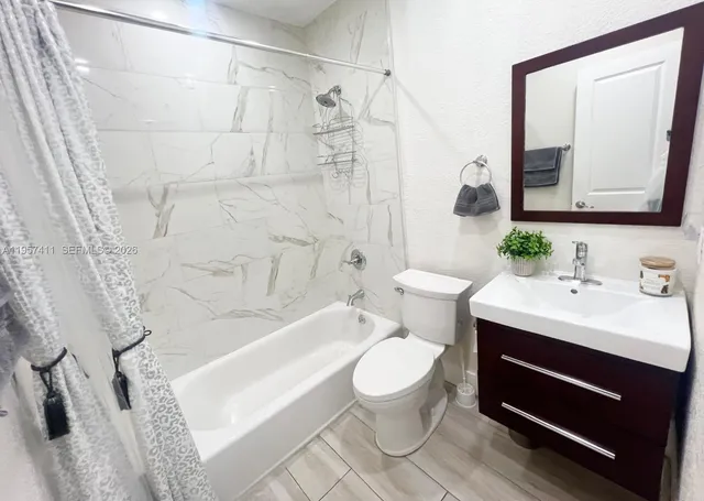 a view of a livingroom with wooden floor