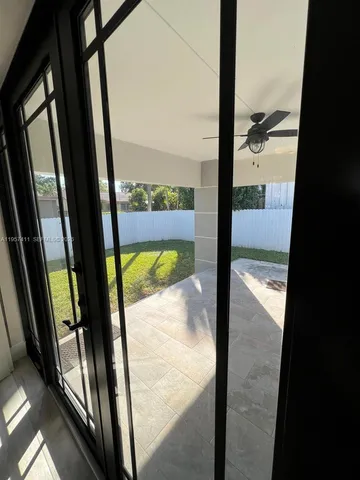a kitchen with stainless steel appliances granite countertop a sink and a stove