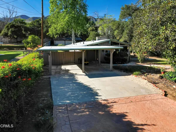 a view of a backyard with patio