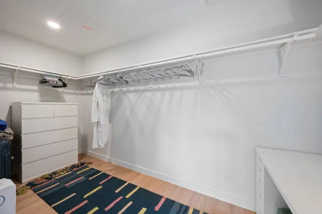 a room with a walk in closet and a window