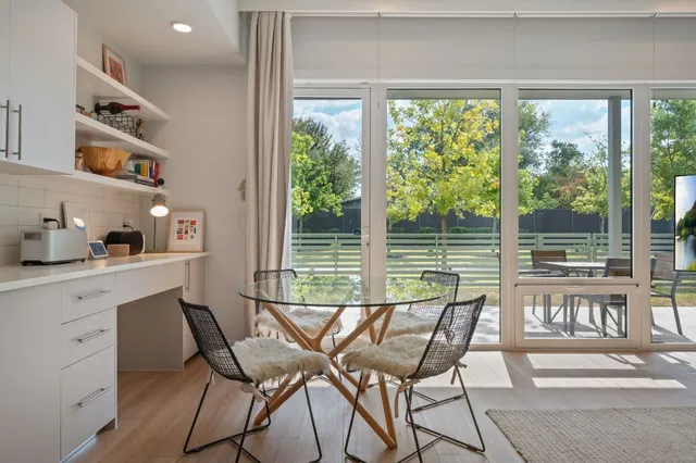 a view of a chairs and table in a room