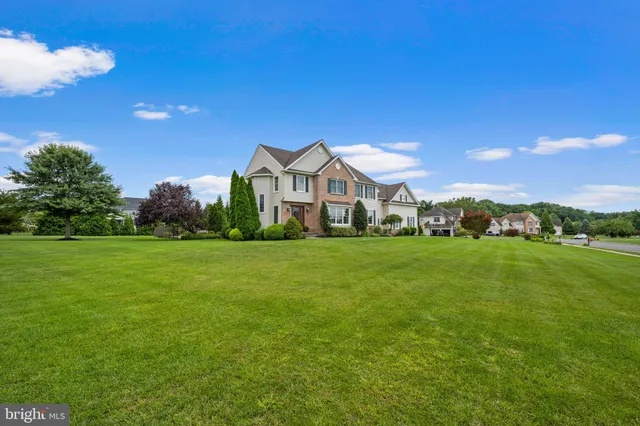 a bathroom with a tub a sink and a shower