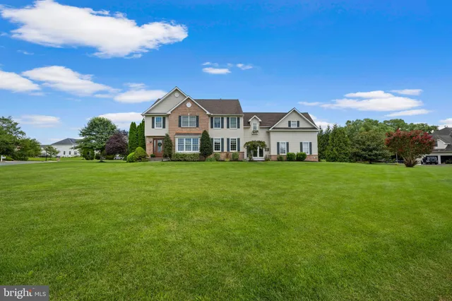 a white bath tub sitting in a bathroom next to a window