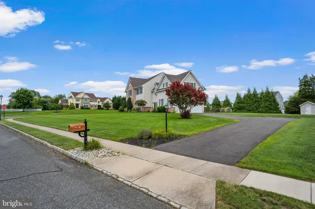 a bathroom with a sink vanity tub and shower