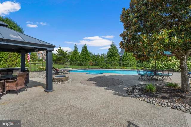 a bedroom with furniture and a chandelier