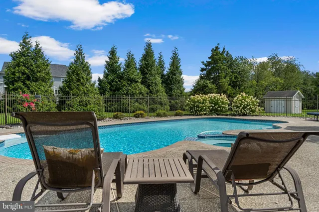 a view of living room with furniture and a fireplace