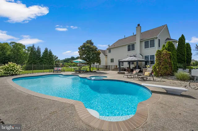 a bathroom with a toilet a sink and a mirror