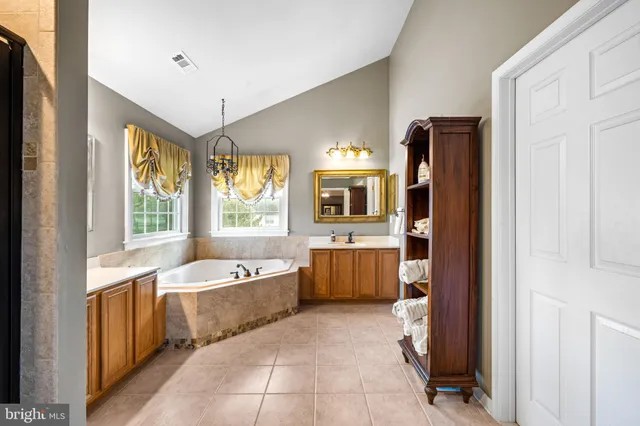 a view of living room with furniture and wooden floor