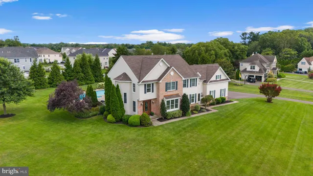 an aerial view of a house with a swimming pool