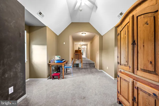 a bed room with a bed and a chair