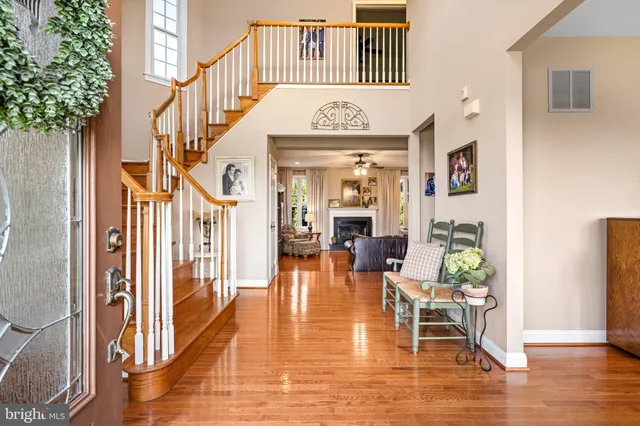a living room with furniture a flat screen tv and gym equipment