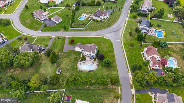 a view of a chairs and table in backyard