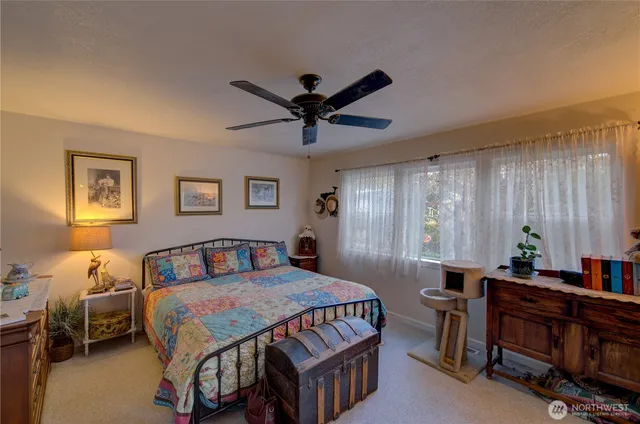 a bedroom with a bed and a table in it